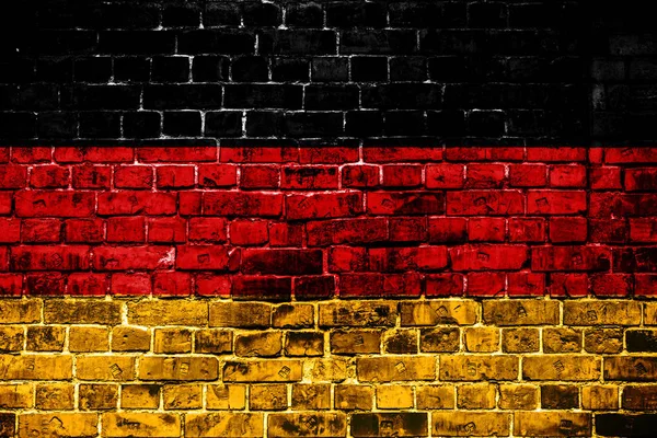 National flag of Germany on a brick background. Concept image for Germany: language , people and culture.