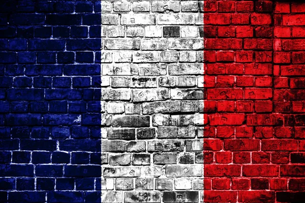 National flag of France on a brick background. Concept image for France: language , people and culture.