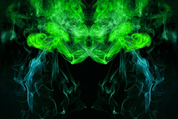 Mocap for cool t-shirts. Thick colorful green smoke  in the form of a monster on a black isolated background. Background from the smoke of vape