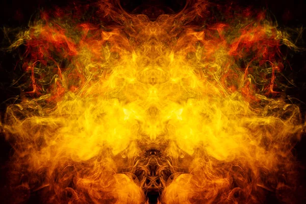 Fantasy print for clothes: t-shirts, sweatshirts.  Colorful yellow and orange smoke in the form of a skull, monster, dragon on a black isolated background. Background from the smoke of vap