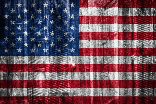 National flag of America on textured wooden background, fence or wall
