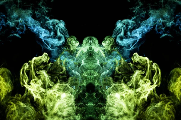 Fluffy Puffs  blue, yellow and green smoke and Fog in the form of a skull, monster, dragon  on Black Background. Fantasy print for clothes: t-shirts, sweatshirts