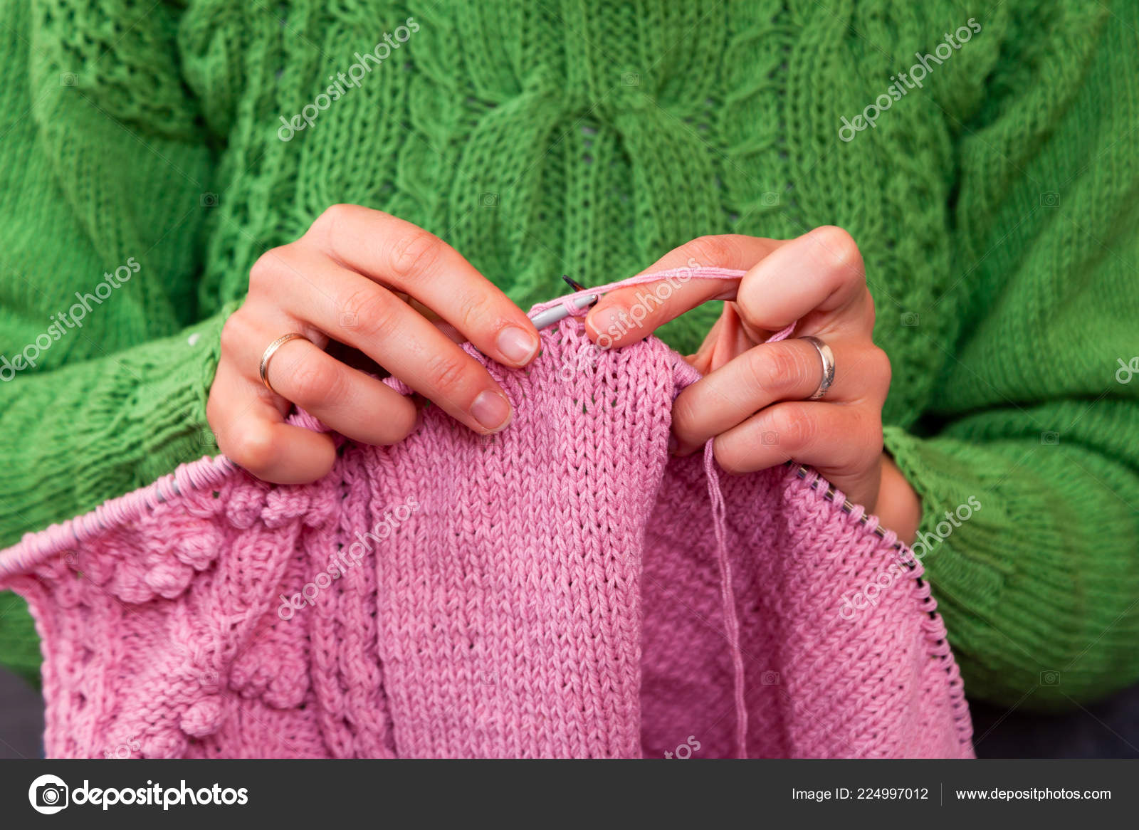 Young woman knits with large knitting needles Vector Image