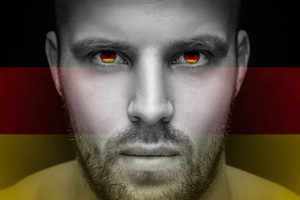 Portrait Young Serious Man Whose Eyes Reflected National Flag Germany — Stock Photo, Image