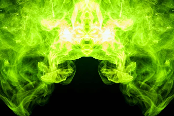 Green  and yellow cloud of smoke of  black isolated background in the form of a skull, monster, dragon on a black isolated background. Mocap for cool t-shirt