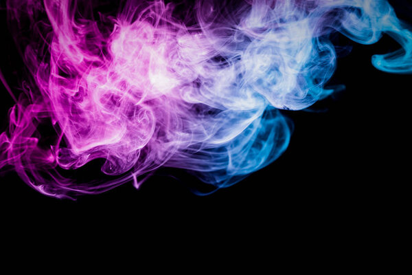 Blue, purple and pink smoke on black backgroun