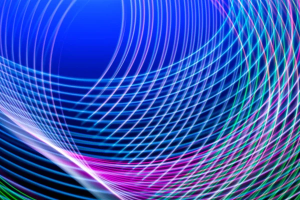 Abstract light blue, pink and purple trails in random motion background image. Striped Neon Lights in Rainbow Colors