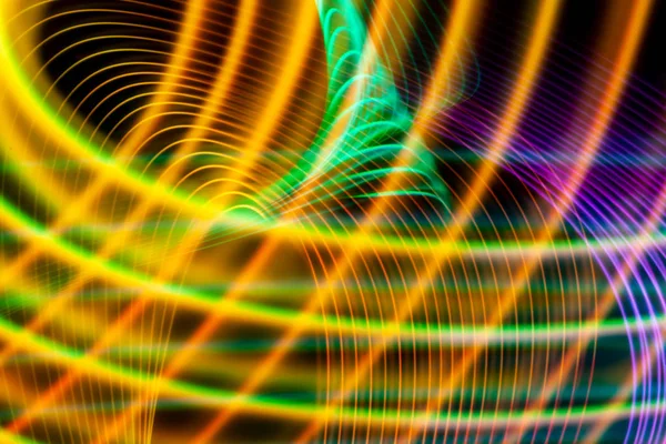 Abstract light rainbow trails in random motion background image.  Striped Neon Lights in Rainbow Colors