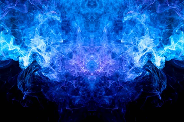 Fantasy print for clothes: t-shirts, sweatshirts.  Colorful pink and  blue smoke in the form of a skull, monster, dragon on a black isolated background. Background from the smoke of vap