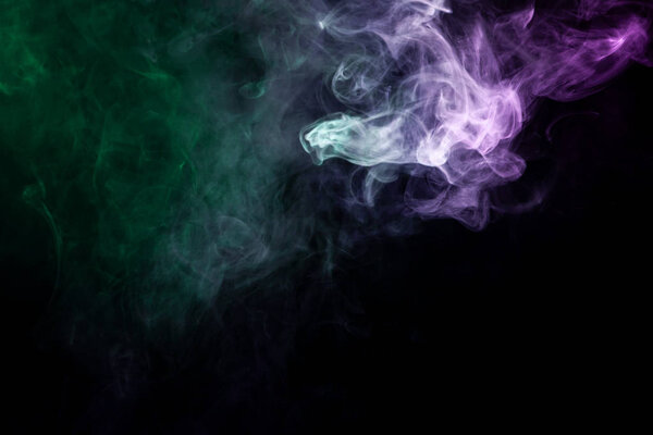 Green and pink cloud smoke on black isolated background