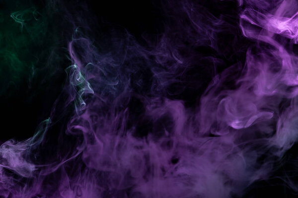 Cloud of pink and blue smoke on a black isolated background. Background from the smoke of vap