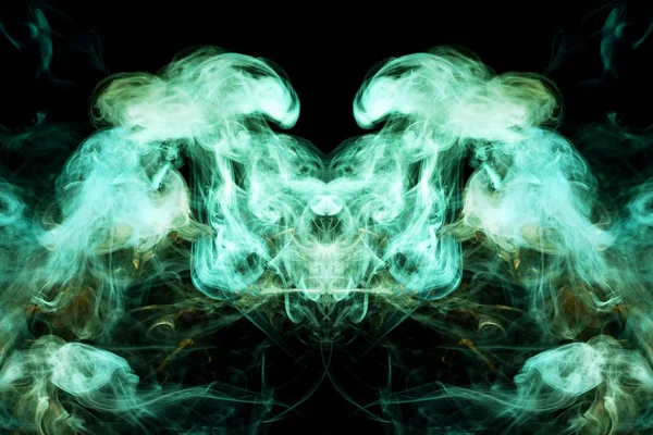 Mocap for cool t-shirts. Thick colorful green and yellow smoke  in the form of a monster on a black isolated background. Background from the smoke of vape