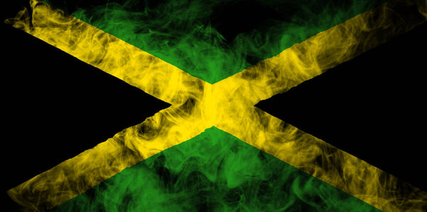 National flag of  Jamaica from thick colored smoke on a black isolated background 