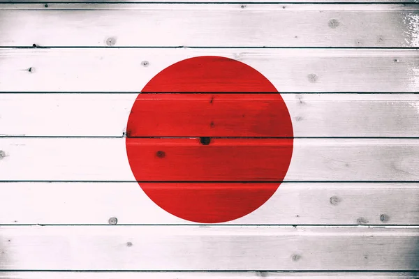 National flag of Japan  on a  wooden background