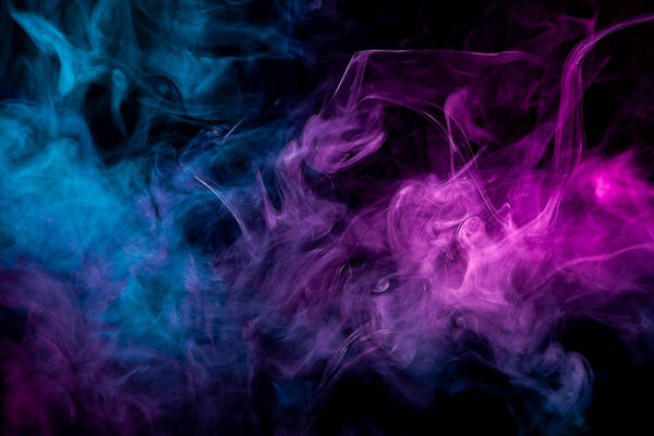 Thick colorful pink and blue smoke in the form of a sky on a black isolated background. Background from the smoke of vape. Mocap for cool t-shirt