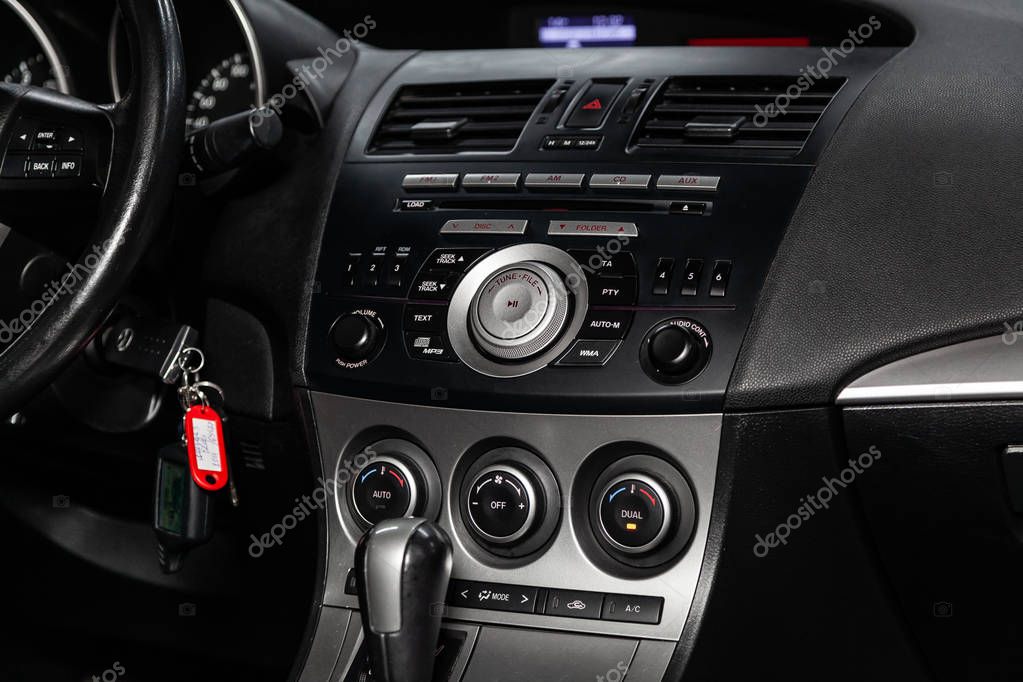 Novosibirsk, Russia - February 05, 2019:  Mazda 3, close-up of the dashboard, adjustment of the blower, air conditioner, player. Photography of a modern car on a parking in Novosibirs