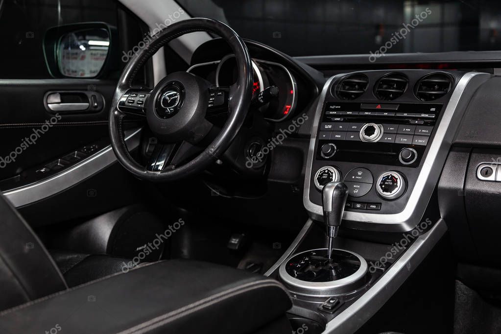 Novosibirsk, Russia -  February 05, 2019:  Mazda CX-7,  close-up of the dashboard, speedometer and tachometer, seats and steering wheel. Photography of a modern car on a parking in Novosibirs