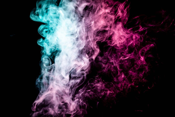 Thick pink and blue smoke on a black isolated background. Background from the smoke of vap