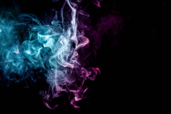 Blue and pink bomb smoke on black isolated background