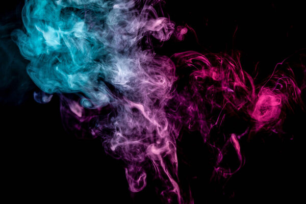 Blue and pink bomb smoke on black isolated background