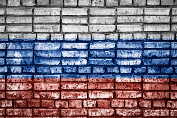 Bir tuğla zemin üzerine ulusal bayrak Rusya'nın. Rusya için kavram görüntü: dil, insanlar ve kültür.