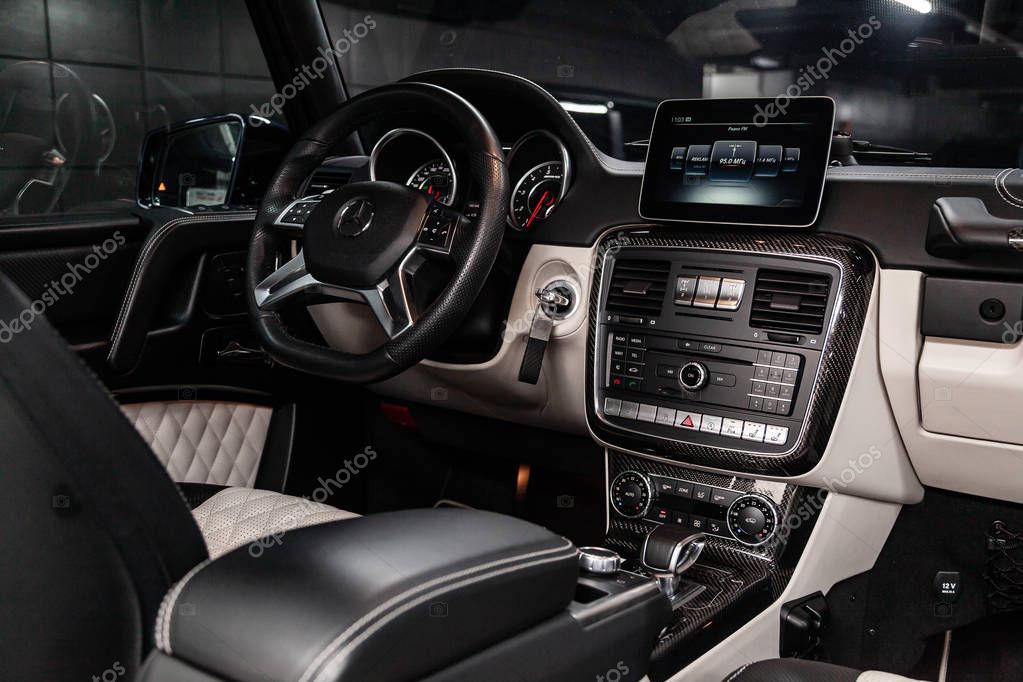 Novosibirsk, Russia - February 19, 2019:  Mercedes G-Class G-63,close-up of the dashboard, speedometer, tachometer, seats and steering wheel. Photography of a modern car on a parking in Novosibirs