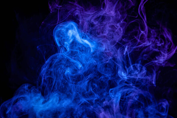 Blue and purple bomb smoke on black isolated backgroun