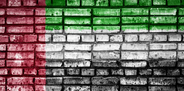 National flag of United Arab Emirates  on a brick background. Concept image for United Arab Emirates: language , people and culture.