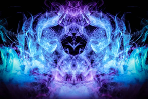 Mocap for cool t-shirts. Thick colorful blue and pink smoke  in the form of a monster on a black isolated background. Background from the smoke of vape