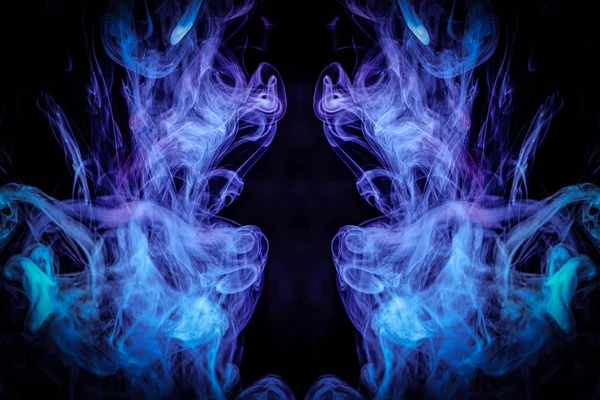 Fantasy print for clothes: t-shirts, sweatshirts.  Colorful pink and blue smoke in the form of a skull, monster, dragon on a black isolated background. Background from the smoke of vap