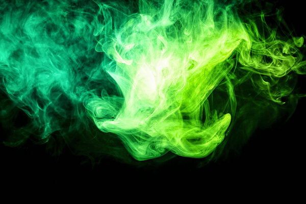 Close up swirling green smoke on black isolated backgroun
