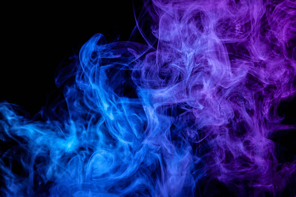 Fog colored with bright blue gel on dark backgroun