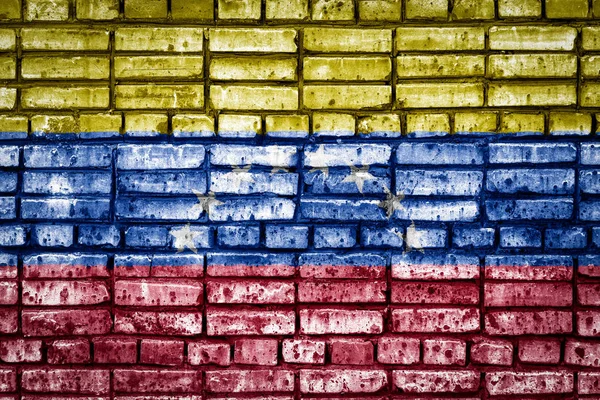 National flag of Venezuela on a brick background. Concept image for Venezuela: language , people and culture.
