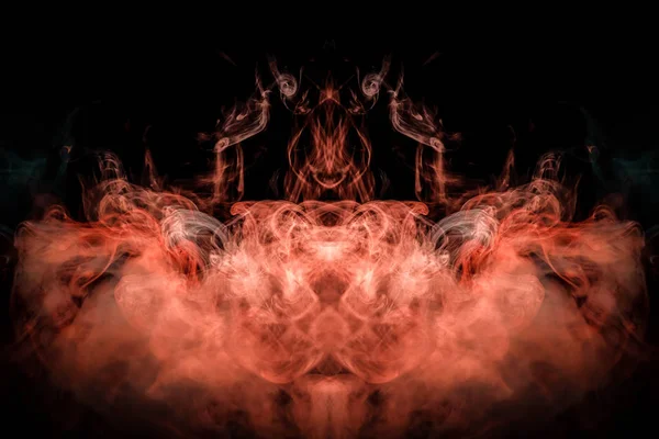 Fantasy print for clothes: t-shirts, sweatshirts.  Colorful blue and red smoke in the form of a skull, monster, dragon on a black isolated background. Background from the smoke of vap
