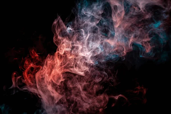 Close up swirling  red and blue smoke on black isolated backgroun
