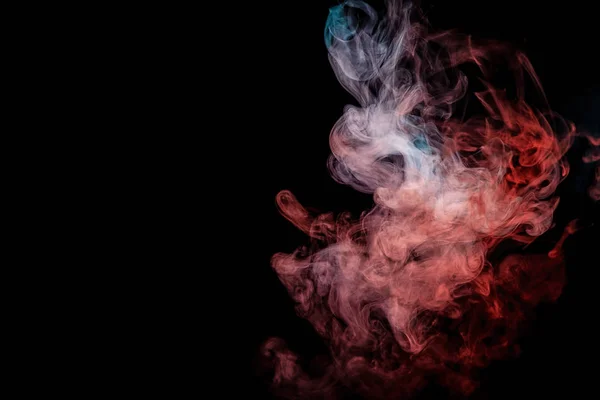 Close up swirling  red and blue smoke on black isolated background