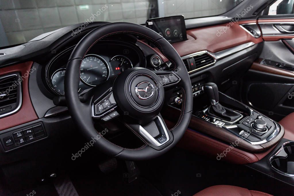 Novosibirsk, Russia - March 15, 2019:  Mazda CX-9,close-up of the dashboard, speedometer, tachometer and steering wheel.Photography of a modern car on a parking in Novosibirs