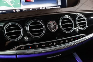 Novosibirsk, Russia - March 15, 2019:  Mercedes Maybach S450 4Matic ,close-up of the dashboard, adjustment of the blower, air conditioner, player. Photography of a modern car on a parking in Novosibirs clipart