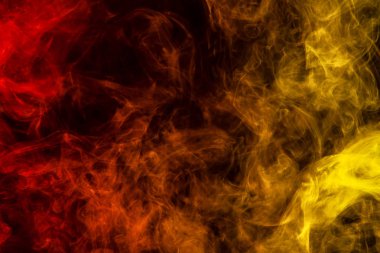 Soyut sanat sarı renkli ve arka plan Turuncu Siyah dumanın izole. Koyu arka plan üzerinde renkli duman durdurmak