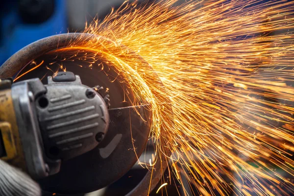 Close Man Sawing Bearing Metal Hand Circular Saw Bright Flashes — Stock Photo, Image