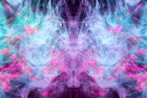 Fantasy print for clothes: t-shirts, sweatshirts.  Colorful pink and blue smoke in the form of a skull, monster, dragon on a black isolated background. Background from the smoke of vap