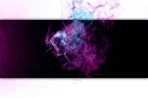 Thick colorful smoke of pink, blue on a black and white isolated background. Background from the smoke of vap