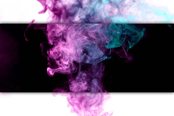 Thick colorful smoke of pink, blue on a black and white isolated background. Background from the smoke of vap