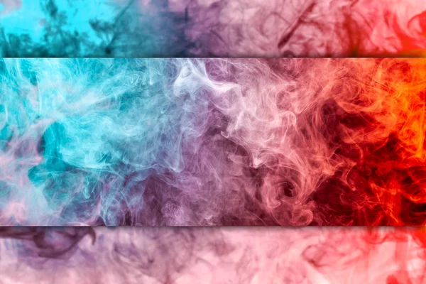 Thick colorful smoke of red and  blue on a black and white isolated background. Background from the smoke of vap