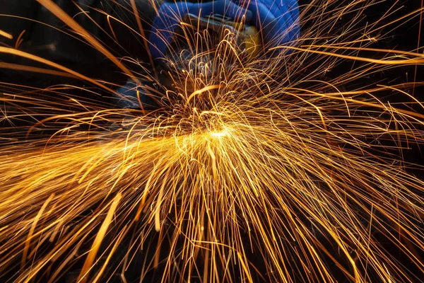 Bright  lighting from spark welding  Iron soldering, Man working on iron soldering, welding sparks.