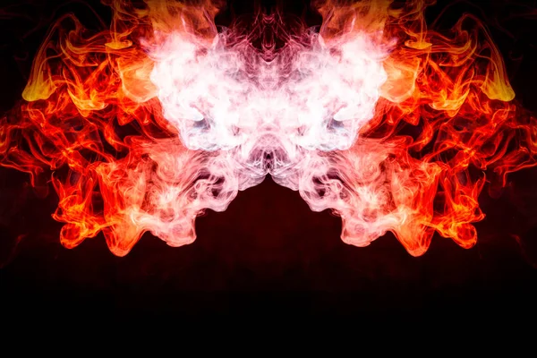 Dense multicolored smoke of   blue and red colors in the form of a skull, monster, dragon on a black isolated background. Background of smoke vape. Mocap for cool t-shirt