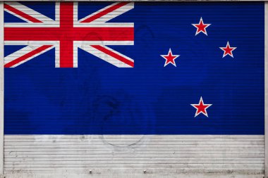 Yeni Zelanda ulusal bayrağı ile eski metal duvar yakın çekim. Yeni Zelanda ihracat-ithalat, malların depolanması ve malların ulusal teslimat kavramı. Grunge tarzında bayrak