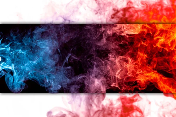 Close up swirling red and blue smoke on black isolated backgroun