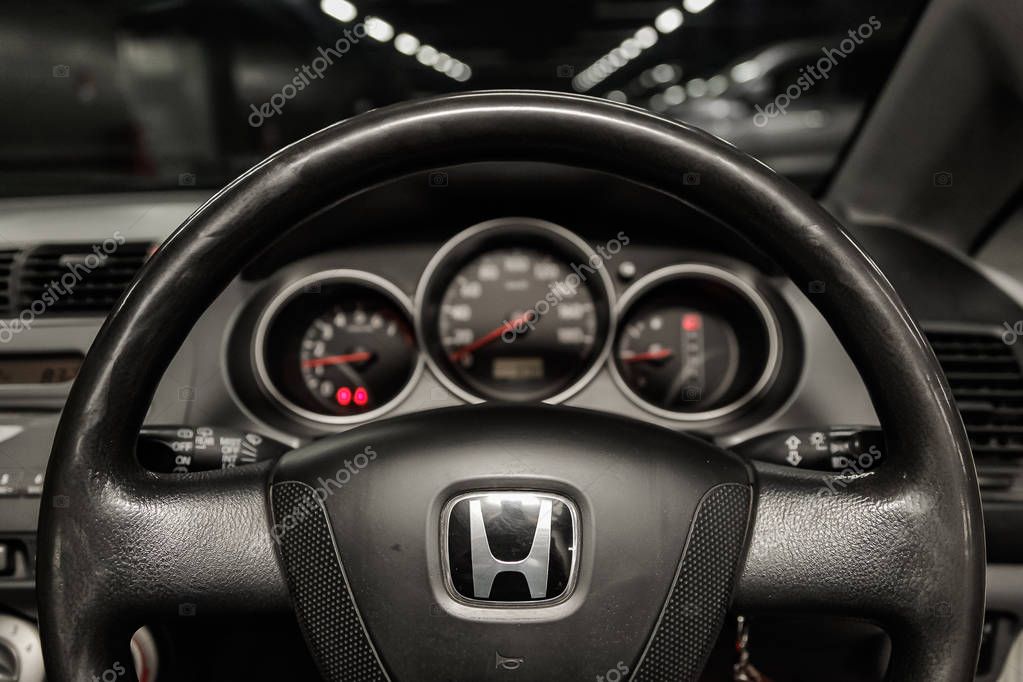 Novosibirsk, Russia - May 06, 2019:  Honda Fit Aria,close-up of the dashboard, speedometer, tachometer and steering wheel.Photography of a modern car on a parking in Novosibirs