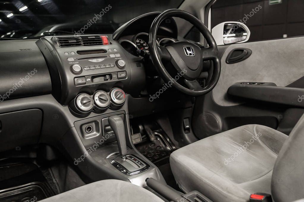Novosibirsk, Russia - May 06, 2019:  Honda Fit Aria,close-up of the dashboard, speedometer, tachometer, seats and steering wheel.Photography of a modern car on a parking in Novosibirs